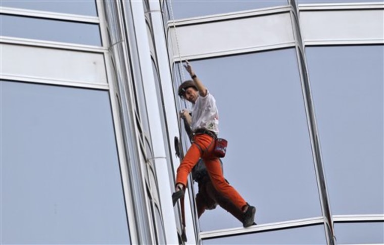 Alain Robert climbs up Burj Khalifa, the world's tallest tower in Dubai, United Arab Emirates, on Monday.
